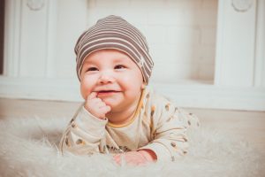 Naperville Dentist showing a Smiling Baby who will be teething soon